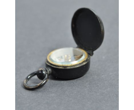 A charming inter-war c1920's F. Barker &amp; Sons miniature compass. The compass set within an opening brass case, the dial o
