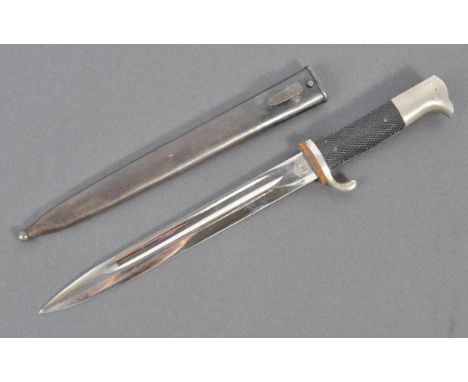 A WWII Second World War era German Nazi Third Reich long KS98 rifle bayonet having chequered grips, steel hooked pommel with 