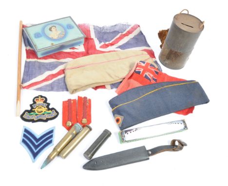 A collection of WWI First World War and WWII Second World War (and later) military and related items, to include; two forage 