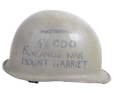 An original 20th century 1980's Falklands War Argentinian soldier's steel helmet. Taken by a member of No. 42 Commando at Mou