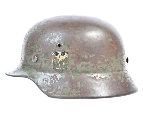 A scarce original WWII Second World War Third Reich Nazi German Army M35 pattern Stalhelm steel combat infantry helmet. Doubl