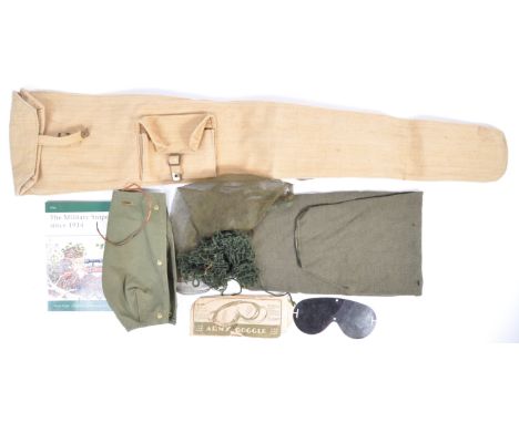 A collection of 20th century British Army Sniper related kit items, to include; a Lee Enfield Rifle canvas carry bag, helmet 