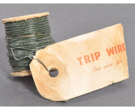 A rare&nbsp;WWII Second World War MI9 / SOE issued unused reel of trip wire. The small reel of green wire (for camouflage pur