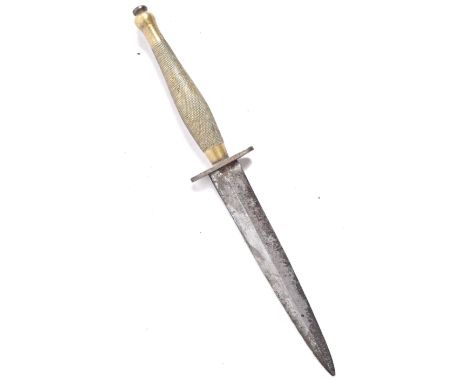 A scarce WWII Second World War Fairbairn Sykes mad Second Pattern commando fighting dagger. The double edged blade etched wit