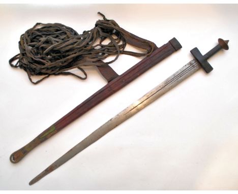 A Northwest&nbsp;African 19th century tribal Tuareg (Twareg or Tourareg) Takouba sword having a clad tooled leather handle of