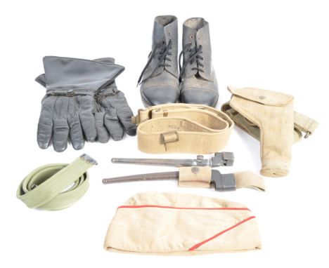 A collection of assorted WWII Second World War and post-war British Army related uniform items to include; x2 WWII Pig Sticke