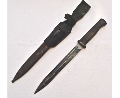 A WWII Second World War German Nazi Third Reich Army standard issue K98 rifle bayonet having wooden grips, steel pommel with 