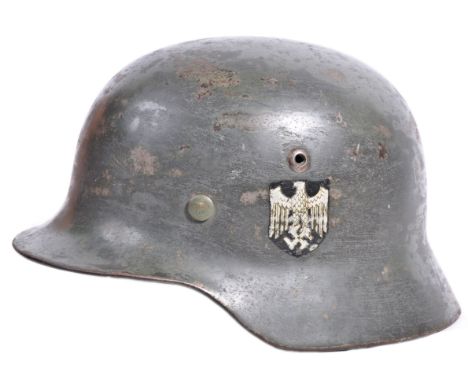 A rare original WWII Second World War Third Reich Nazi German Army M40 steel infantry helmet. Single decal variation, the rim