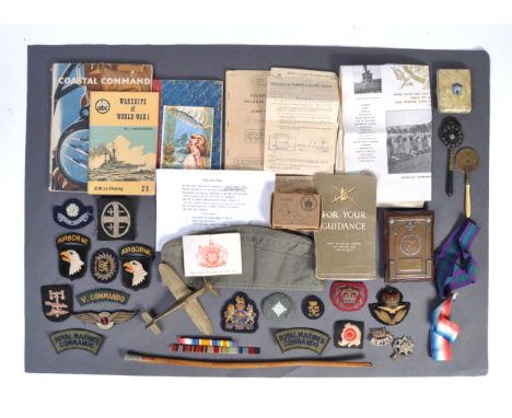 A collection of assorted 20th century WWI, WWII and later military items, to include; a ' Screaming Eagle ' Airborne uniform 