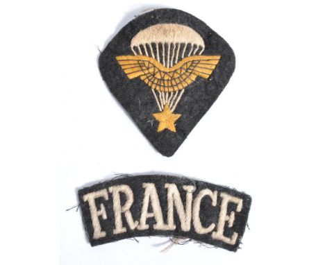 Two original WWII Second World War uniform patches, comprising; a ' Free French Forces ' ' FRANCE ' cloth shoulder patch, and
