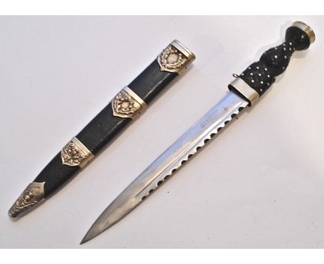 A vintage 20th Century Scottish Highland Regiment Officers / Pipers / drummers Dirk dagger having a traditional ebonised and 