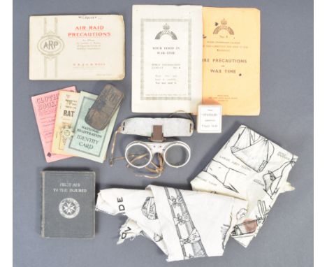 A collection of assorted WWII Second World War related militaria to include largely ARP Air Raid Precautions and Red Cross ' 