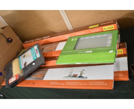 A Collection of Four New and Unopened Floating Glass Shelves, Roller and Tray Set and Glass Chopping Board 