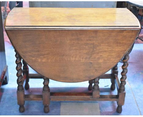An Edwardian Oak Drop Leaf Gate Leg Barley Twist Table, 90cm long 