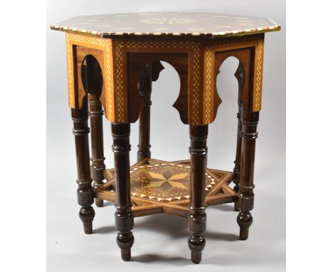 A Highly Varnished Inlaid Octagonal Topped Table with Stretcher Shelf and Turned Supports, 51cm Diameter 