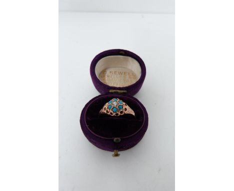 A vintage 9ct rose gold paste cluster ring, hallmarked Sheffield, 1985, SJ Ltd. Engraved decoration to the sides, set with cu