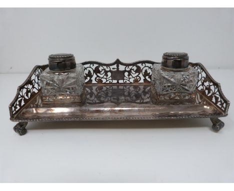 A silver and glass piercework desk inkwell, two bottles with silver tops and rope edging. Ink bottles removeable. Birmingham,