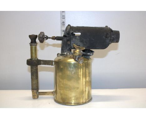 A large vintage brass blow lamp 