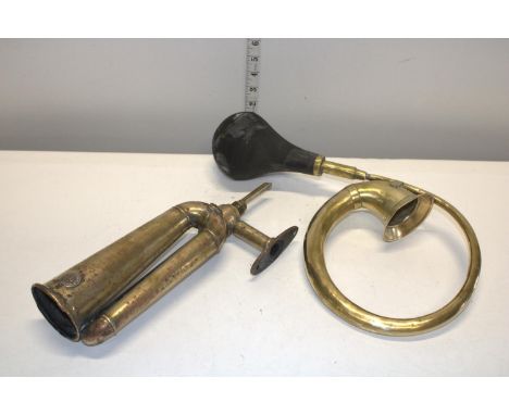 Two vintage brass horns 