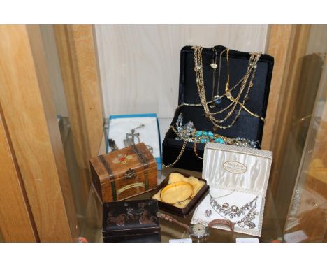 A shelf full of costume jewellery &amp; other items 