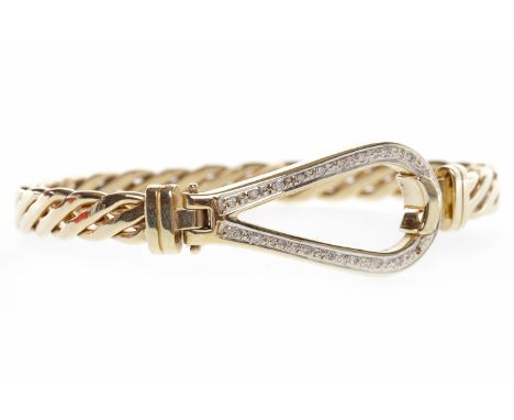 NINE CARAT GOLD DIAMOND SET BANGLE
of oval form, with twist decoration, with a diamond set open clasp section, 72mm to outer 