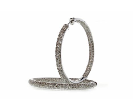 PAIR OF FOURTEEN CARAT WHITE GOLD DIAMOND HOOP EARRINGS
each with diamonds pave set to the front half and with diamonds to th