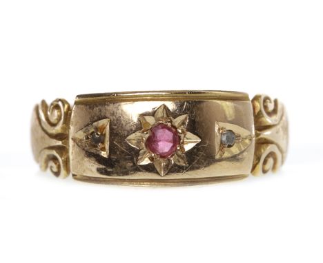 VICTORIAN EIGHTEEN CARAT GOLD RUBY AND DIAMOND SET BAND
with a central star set ruby flanked by two round diamonds, on engrav