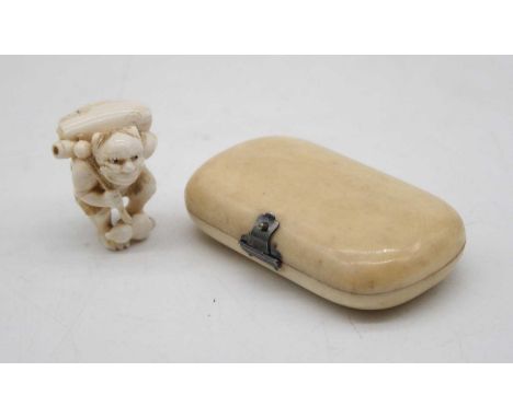 A Japanese Meiji period ivory netsuke carved as a man in crouching pose with bag upon his back, signed, together with an earl