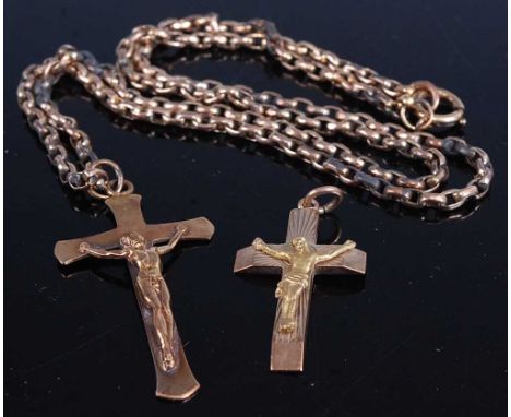 Two 9ct gold crucifix pendants, 7.2g, on a gilt metal belcher link neck chain (3)Condition report: Tarnished