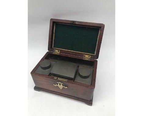 A George III mahogany tea caddy, of typical rectangular form, the hinged lid opening to reveal three tin compartments and bai