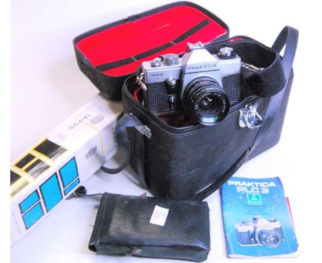 A collection of vintage photography equipment to include a Praktica PLC3 camera