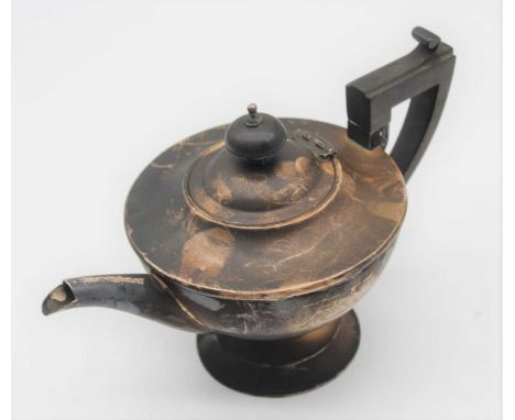 A George V silver bachelor's teapot of plain undecorated form having angular ebonised handle, weight 9.1oz 