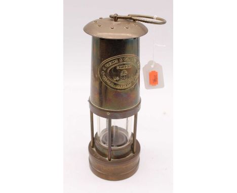 An early 20th century Thomas &amp; Williams Welsh brass miner's lamp, height 26cm