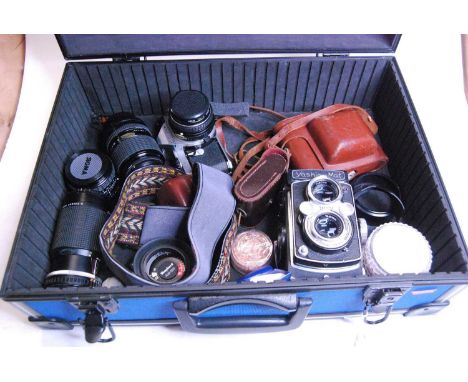 A collection of vintage photography equipment to include a Pentax ME Super camera
