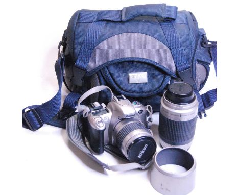 A Nikon F55 camera with travel bag and accessories