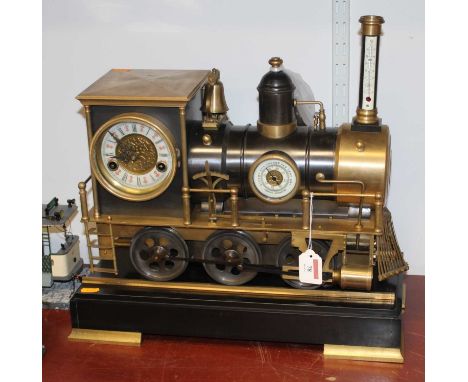 A  mantel clock, barometer and thermometer in the form of a steam locomotive mounted upon a polished black hardstone plinth, 