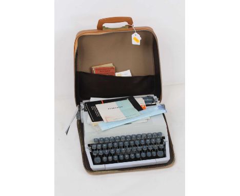 A vintage cased Imperial typewriter, with instructions, paperwork and guarantee 