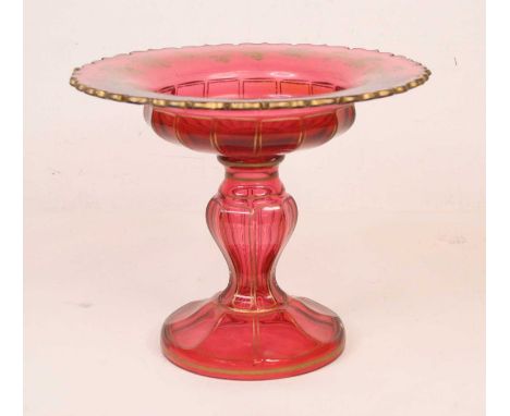 A 19th century ruby glass comport, gilt decorated with trailing vines, standing upon a circular foot, height 22cm