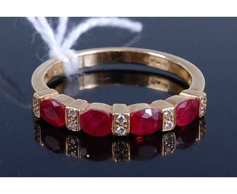 A yellow metal, ruby and diamond half hoop eternity ring, featuring four oval faceted rubies alternating with five pairs of m