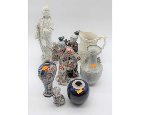 A collection of 18th century and later ceramics to include a blanc de shine figure of Guan Ying and an enamel painted vase, a