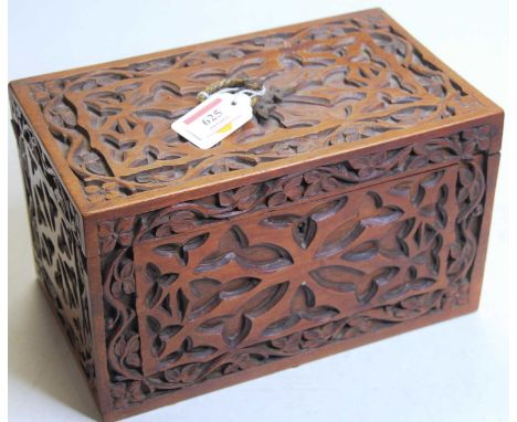 A late 19th / early 20th century Anglo-Indian tea caddy, of rectangular form, having all-over fret carved decoration, w.26cmC