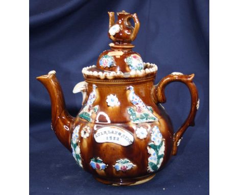 An early 20th century bargeware teapot inscribed Auld Lang Syne 1911, height 29cm