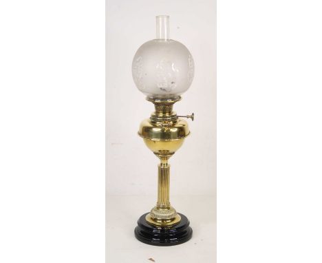 A late 19th century brass oil lamp inscribed Youngs Central Draught to the handle, height 77cm