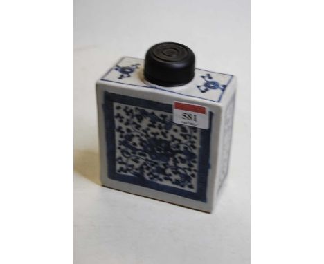 A Chinese export tea caddy, of slab-sided rectangular form, underglaze blue decorated with flowers, having wooden cap, h.14cm