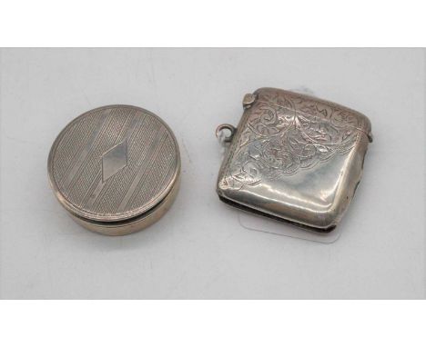 An Edwardian silver vesta of hinged rectangular form having floral engraved decoration together with a George V silver pill b