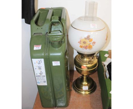 A green painted jerry can together with a brass oil lamp