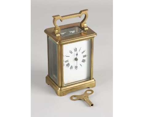 Antique French brass travel alarm clock with enamel dial and facet cut glass.&nbsp;Circa 1900. Dimensions: 12 x 7 x 6.5 cm.&n