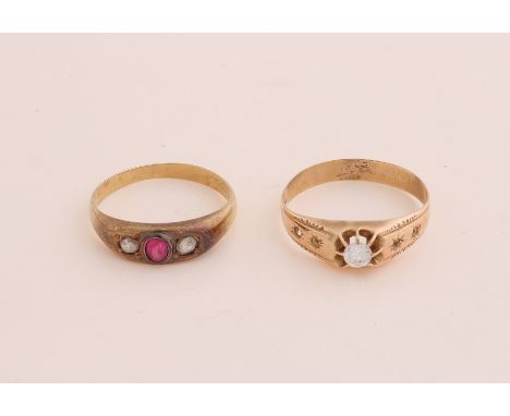 Two yellow gold rings, 585/000, with stones.&nbsp;A ring with ruby ??and 2 diamonds with an old cut and a ring with zirconia,