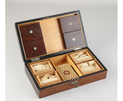 Mahogany playing card cassette containing four mahogany lidded boxes with playing cards.&nbsp;First half 20th century.&nbsp;D