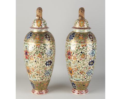 Two large antique chinoiserie ceramic Fischer Budapest vases.&nbsp;Circa 1890. One vase chip lid + lion.&nbsp;One vase lid da